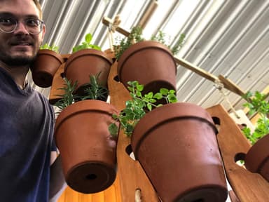 Will from The Pot Slot with herb garden